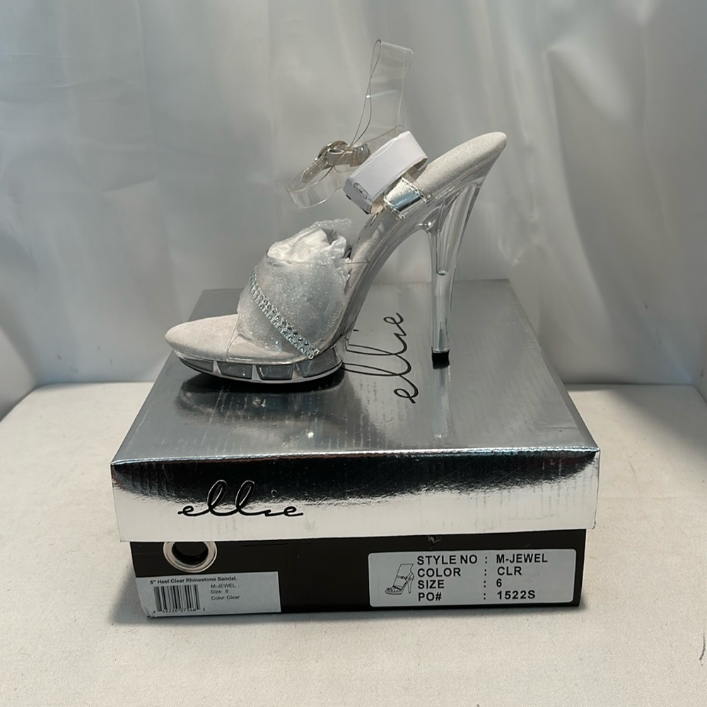 Clear heels 5 inch M jewel is new in the box rhinestone strap across the top